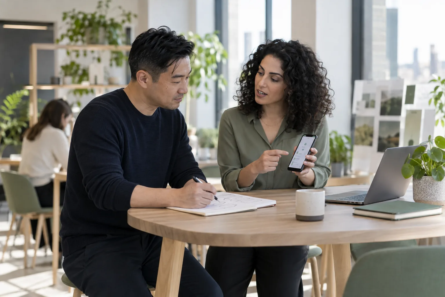 Illustrative scene of a digital platform team reviewing a mobile customer journey.